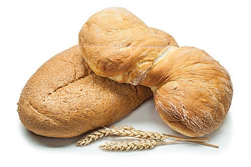 two loafs of bread and wheat ears isolated  on white background