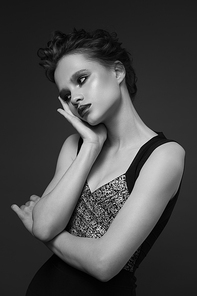 Fashion portrait of young woman. Black and white image.