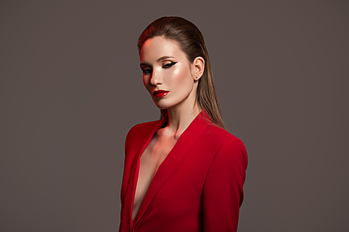 Fashion portrait of stylish woman in red jacket.
