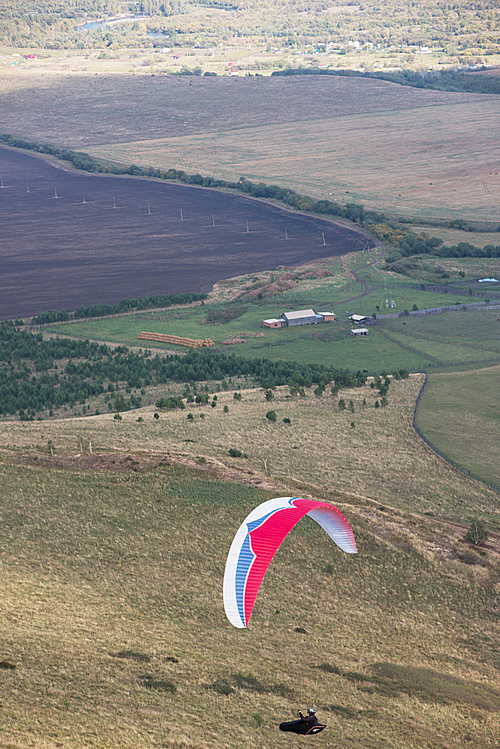 Paragliding in the mountains. Paragliders in fight in the mountains, extreme sport activity.