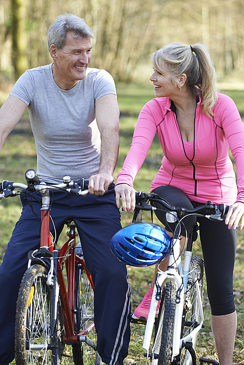 Mature Couple On Cycle Ride In Countryside Together