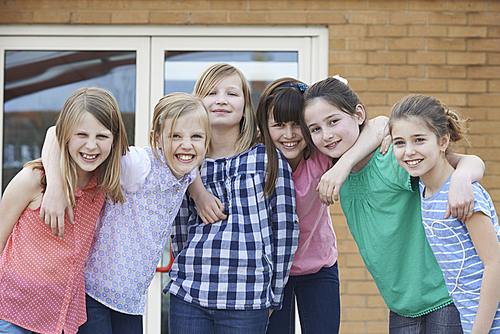 Portrait Of Female Elementary School Pupils Outside Classroom