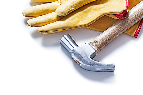 claw hammer and  yellow  leather gloves isolated