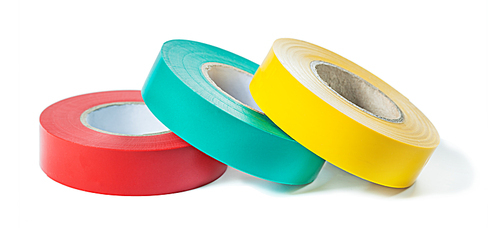 red blue yellow rolls of insulation tape isolated on white