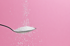 White Sugar Pouring From A Spoon
