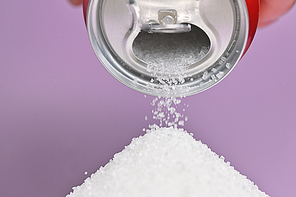 Hand Holding A Soda Can Pouring Sugar