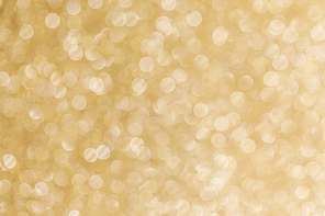 Abstract shining glitters golden holiday bokeh background with copy space for text