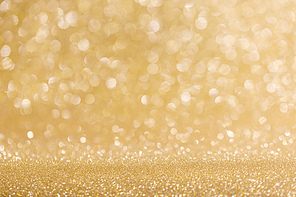 Abstract shining glitters golden holiday bokeh background with copy space for text