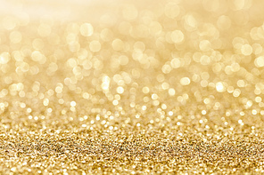 Shiny golden bokeh glitter lights abstract background, Christmas New Year party celebration concept