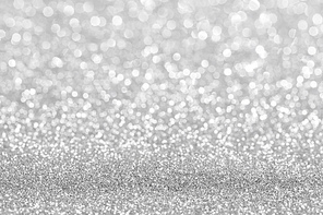 Shiny silver bokeh glitter lights abstract background, Christmas New Year party celebration concept