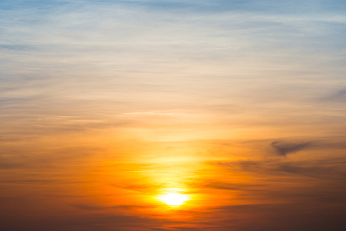 Beautiful sky and clouds with orange dramatic sunset. Can be used as abstract or nature background