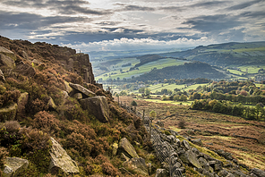 Beautiful Autumn Fall landscape image of countryside view from Curbar Edge in Peak District England at sunset