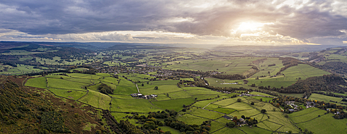 Beautiful Autumn Fall landscape aerial drone image of countryside view from Curbar Edge in Peak District England at sunset