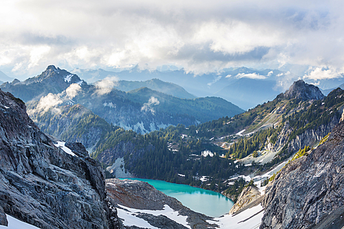 Serenity lake in the mountains in summer season. Beautiful natural landscapes.