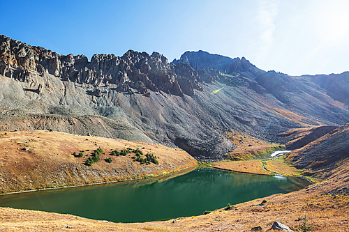 Serenity lake in the mountains in summer season. Beautiful natural landscapes.