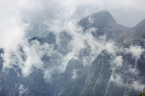 Beautiful morning scene in the mountains. Fog at sunrise.