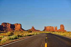 Empty scenic highway in Monument Valley, Arizona, USA