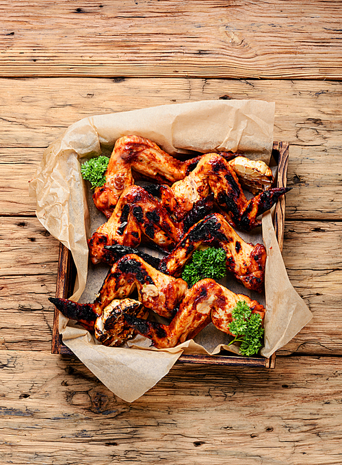 Spicy marinated chicken wings grilling, barbecue.BBQ.American food
