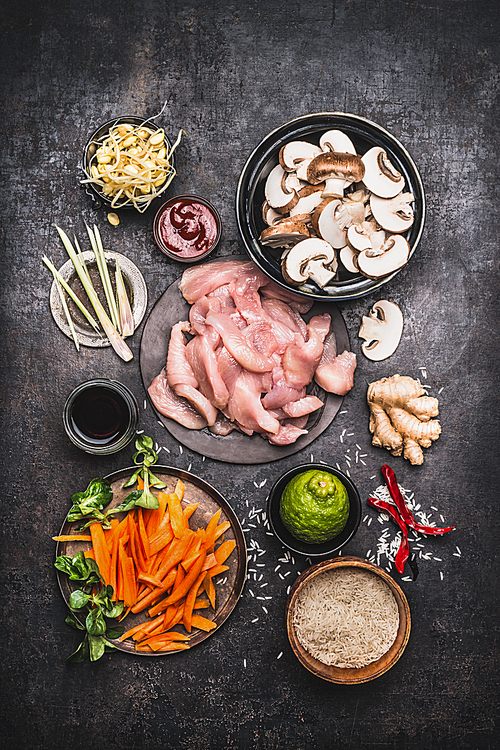 asian cooking ingredients for chicken 밥 dish with vegetables on dark rustic background , top view, flat lay