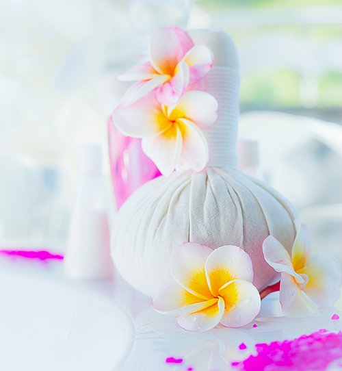 Spa and wellness setting with frangipani flowers
