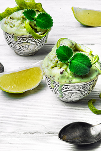 summer ice cream flavored with lime and mint in stylish bowls