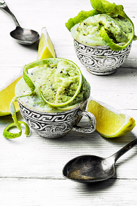 summer ice cream flavored with lime and mint in stylish bowls