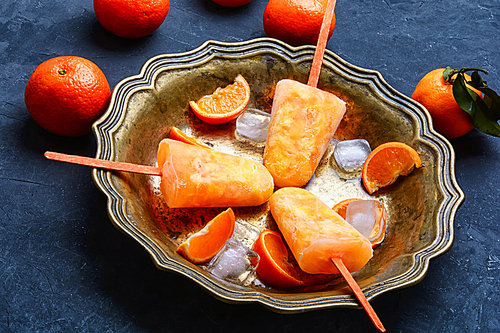 Homemade ice cream with Mandarin orange flavor in stylish dish