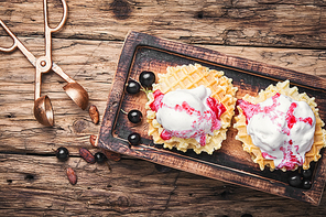 Ice cream on baked wafers with cherries