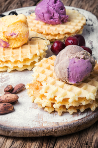 Ice cream on baked wafers with cherries