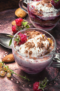 Sundae ice cream with raspberry flavours in glass mug