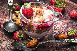 Sundae ice cream with raspberry taste in a glass mug