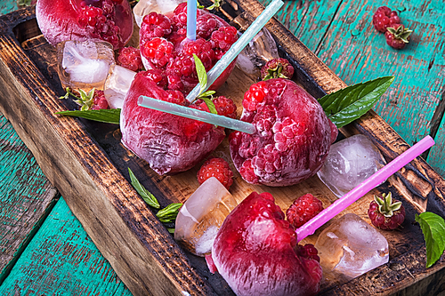 Close up of frozen raspberry juice with ice