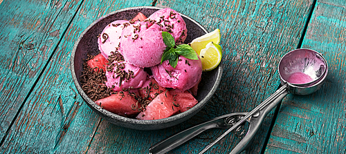 Watermelon ice cream with grated chocolate and lime