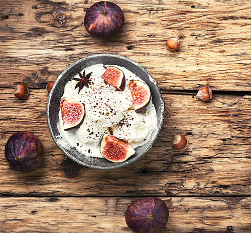 ice cream with figs on old vintage wooden background