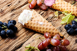 Ice cream cone vanilla and grape flavor.Ice cream in a waffles