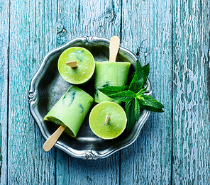 Tasty mint ice-cream on wooden board.Sweet dessert.