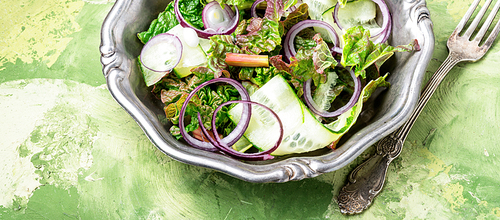 Fresh salad plate with mixed greens.Rhubarb salad.Vegetarian spring salad