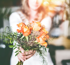 Roses bunch in female hand