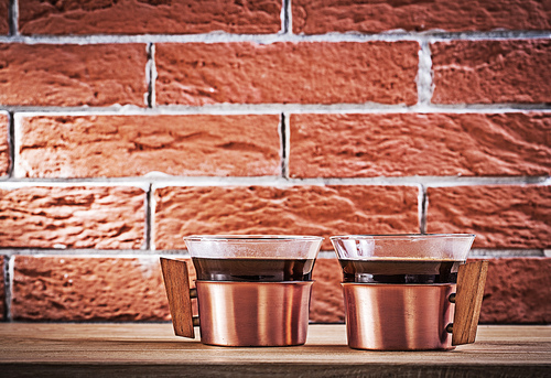 vintage copper coffee cups on background.