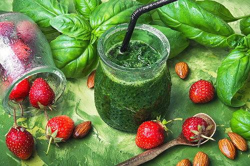 Freshly green smoothie of spinach and strawberry in glass jar.Healthy Eating