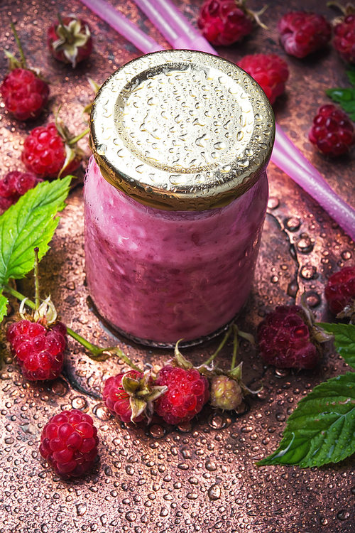 Raspberry yogurt ,dessert with ripe berries in a glass