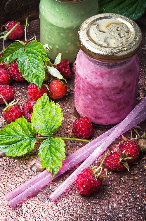 Raspberry yogurt ,dessert with ripe berries in a glass