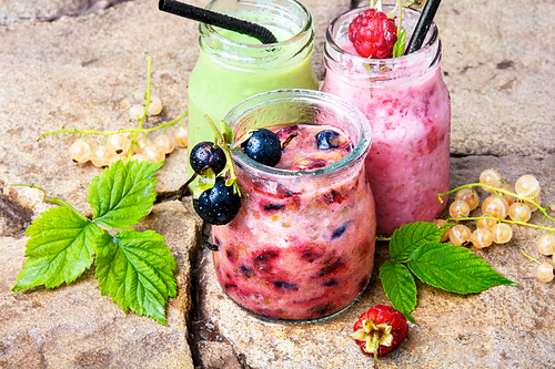 drink smoothies from currant in jar on a stone background