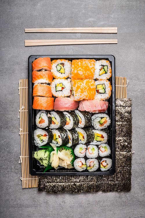 Sushi setting with outside and inside rolls, top view