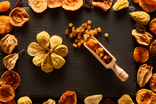 Dried fruits on slate plate background