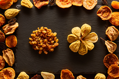 Dried fruits on slate plate background