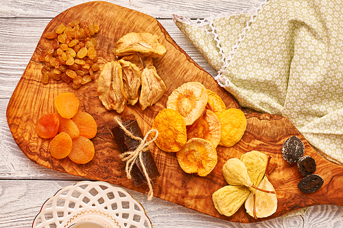 Dried fruits on vintage rustic wooden background