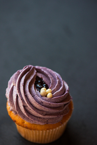 Cupcake desert cream with space for text on a stone background