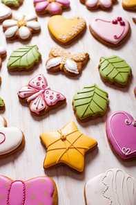 A set of delicious homemade gingerbreads of various shapes laid out on the table