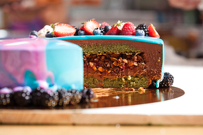 Tasty colorful cake with fresh summer berries